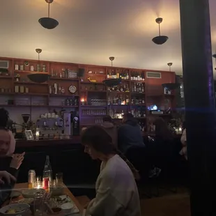 a group of people eating at a restaurant