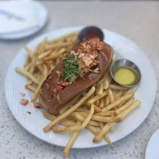 LOBSTER ROLL*: Warm Lobster, Garlic Butter, French Fries (Sub.), Served with Drawn Butter * $28.99