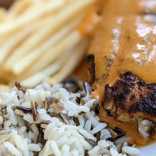 Blackened mahi with mango chipotle with wild rice and fries.  Delicious!  Recommend getting the sauce on the side