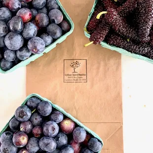 blueberries and blackberries in baskets