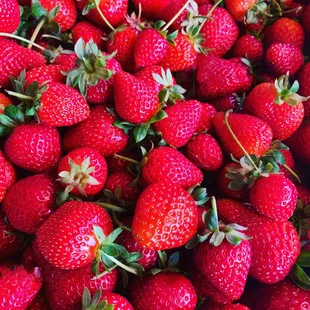 a large pile of strawberries