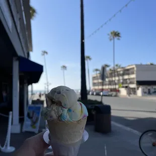 Birthday cake ice cream on a sprinkle cone