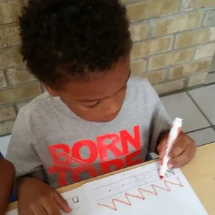 Practicing writing our letters &amp; numbers