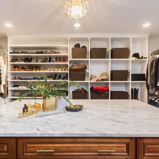 Master closet island and custom built in shelving