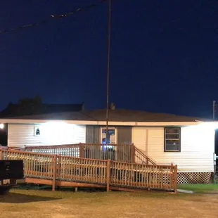 the front of the restaurant at night