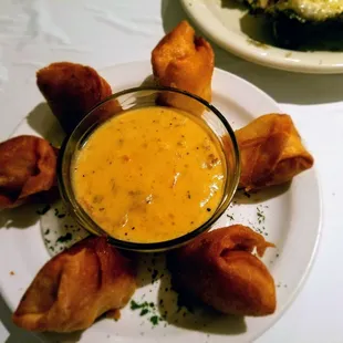 a plate of appetizers and a bowl of soup