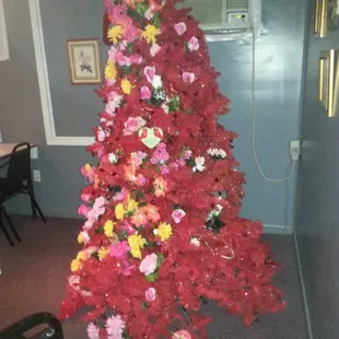 a christmas tree decorated with flowers