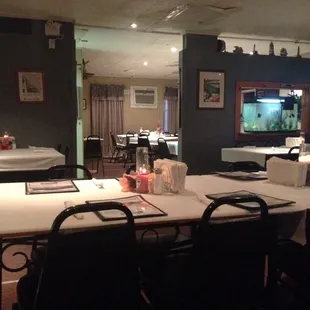 a dining room with tables and chairs