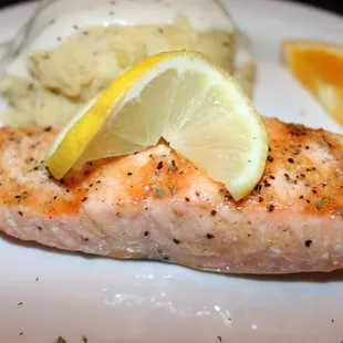 a piece of salmon and mashed potatoes