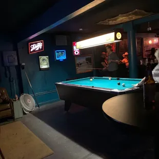 a billiards table in a bar