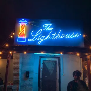 a man standing in front of a building