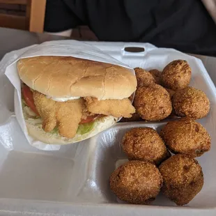 Fish sandwich and hush puppies. Don&apos;t skip out on hush puppies!! So fluffy inside and crispy outside.