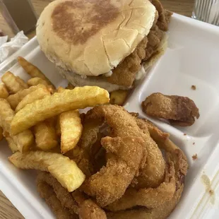 Fish Sandwich, fries, and onion rings