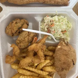 Seafood platter! Stuffed crab, 1 fish, 3 shrimp, 2 oysters, toast, French fries and Cole slaw! So delicious!