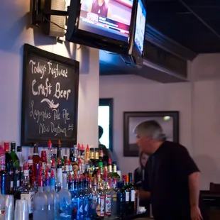 a man standing at the bar