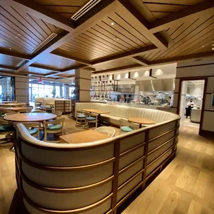 a restaurant with a curved counter