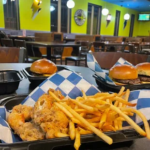 a tray of fries and burgers