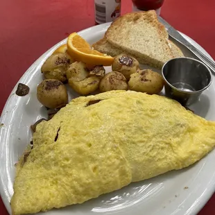 Omelettes in the style of your imagination. Potatoes  ana toast.