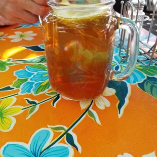 The iced tea in a glass mug.