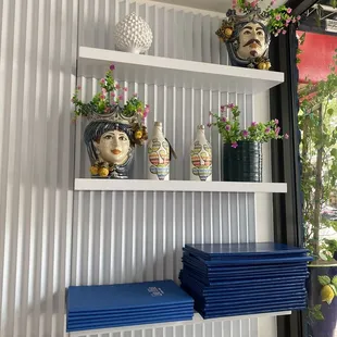 a shelf with vases on it