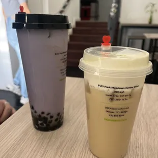 a plastic cup of bubble tea and a plastic cup of iced coffee