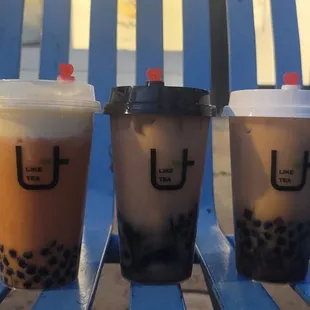 three drinks on a blue chair