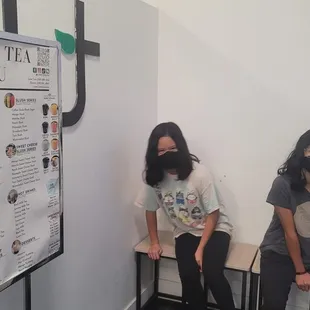 two women sitting on a bench