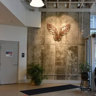 people sitting at tables in a coffee shop