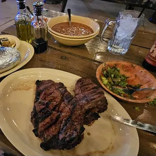 T-Bone, grilling beans, salad, baked potato, Texas toast.