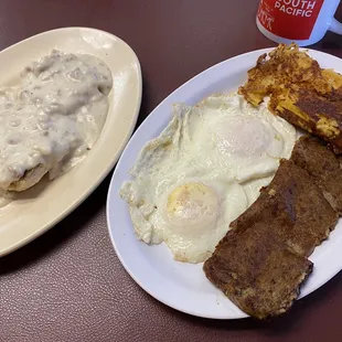 Eggs with scrapple and hash browns with cheese and onions. Biscuit and country gravy. Yummy
