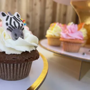 a cupcake with a zebra on top