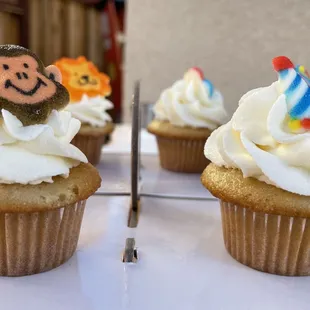 cupcakes with frosting and decorations