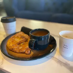 Chicken Masala Calzone with my doppio to the right and spiced apple chai to the left