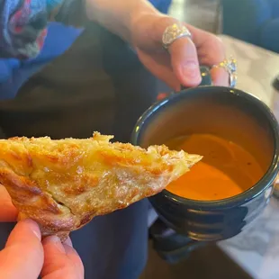 Dipping the calzone in the masala
