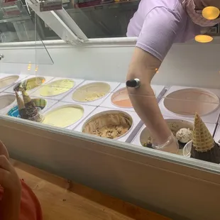  woman looking at ice cream cones
