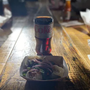 5 Pork &amp; Leek dumplings, no sides ($10) with a diet coke ($?, no price listed so I just swiped my card)