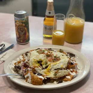 Chilaquiles with steak and eggs $18.        Adult beverages for breakfast