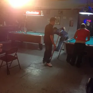  group of people playing pool