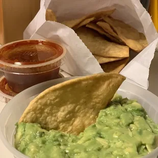 Chips and Salsa with side of guacamole, really good! Chips are homemade!
