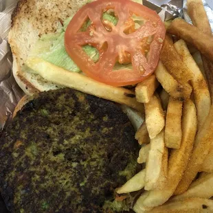 Veggie burger with fries. Served open-faced; easy for adding other condiments.