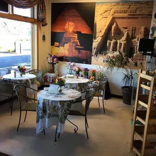 a dining area with tables and chairs