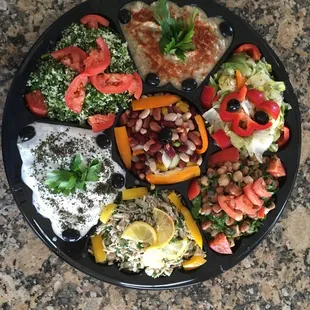 Party platter of seven different salads/dips. Beautifully arranged, super fresh and tasty!