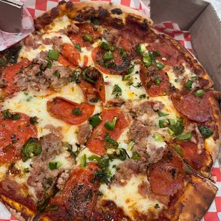 10" pizza with pepperoni, sausage, and jalapeños