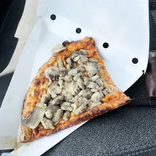 a slice of mushroom pizza