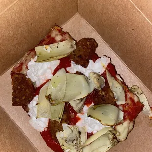 Pizza by the Slice with sausage, artichoke and ricotta