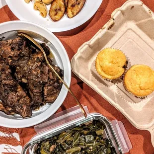 Two oxtail plates with green beans, mac and cheese, and plantains (and of course, cornbread muffins)