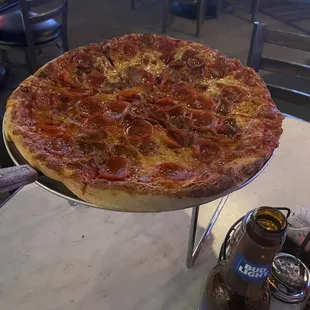 Pepperoni and sausage pizza.  Bud light