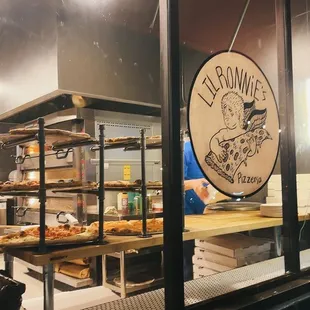a view of a bakery through the window