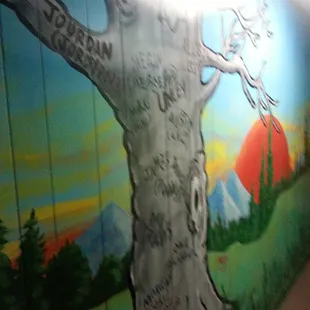a painted mural of a tree