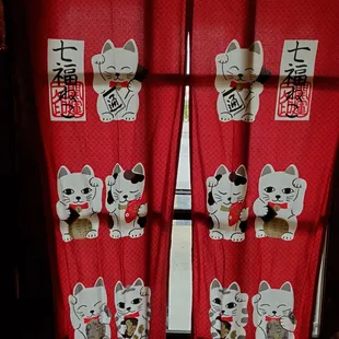 a display of lucky cat decorations